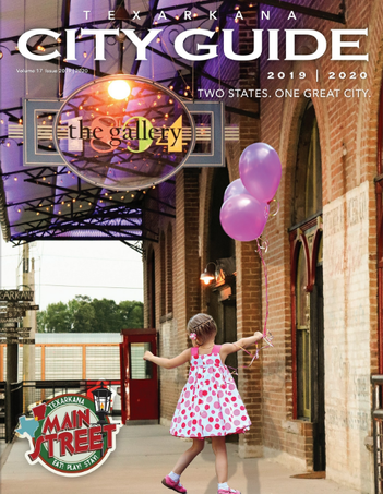 Texarkana City Guide cover: Girl with balloons near a brick building with 