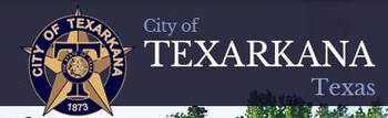 City of Texarkana, Texas logo. A star and text on a dark blue background with trees below.