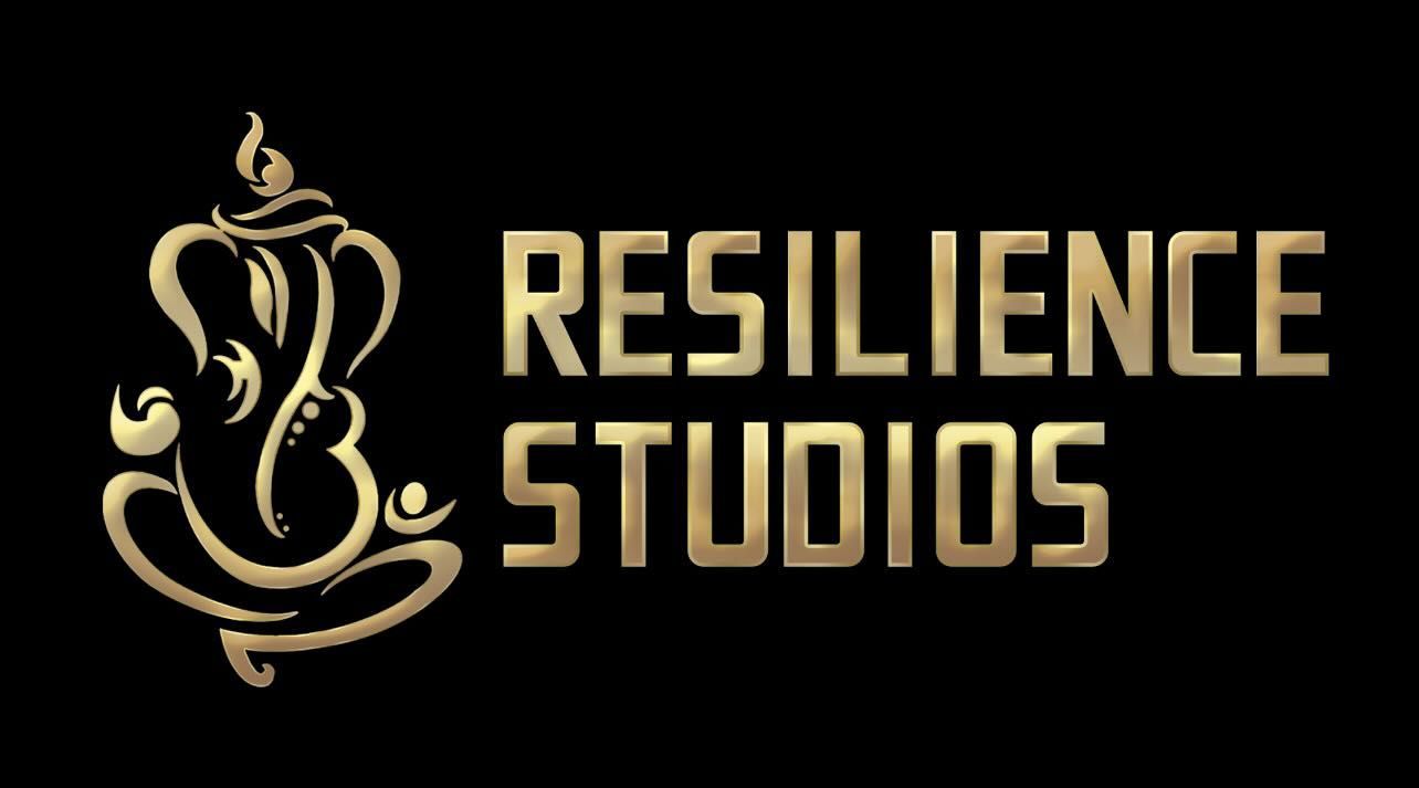 Gold logo of Ganesha next to