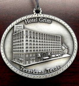 Ornament of the Hotel Grim in Texarkana, Texas. Silver with detailed building engraving.