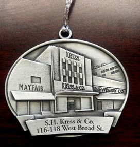 Silver ornament of S.H. Kress & Co. building at 116-118 West Broad St. Also includes 