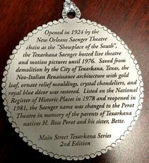 Plaque about the history of the Perot Theatre in Texarkana, Texas, with engraved text.