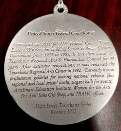Medallion, United States Federal Courthouse. Engraved text details building history and current use, with 