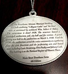 Plaque with text about the Texarkana Municipal Building in Arkansas, listing its history and notable performers.