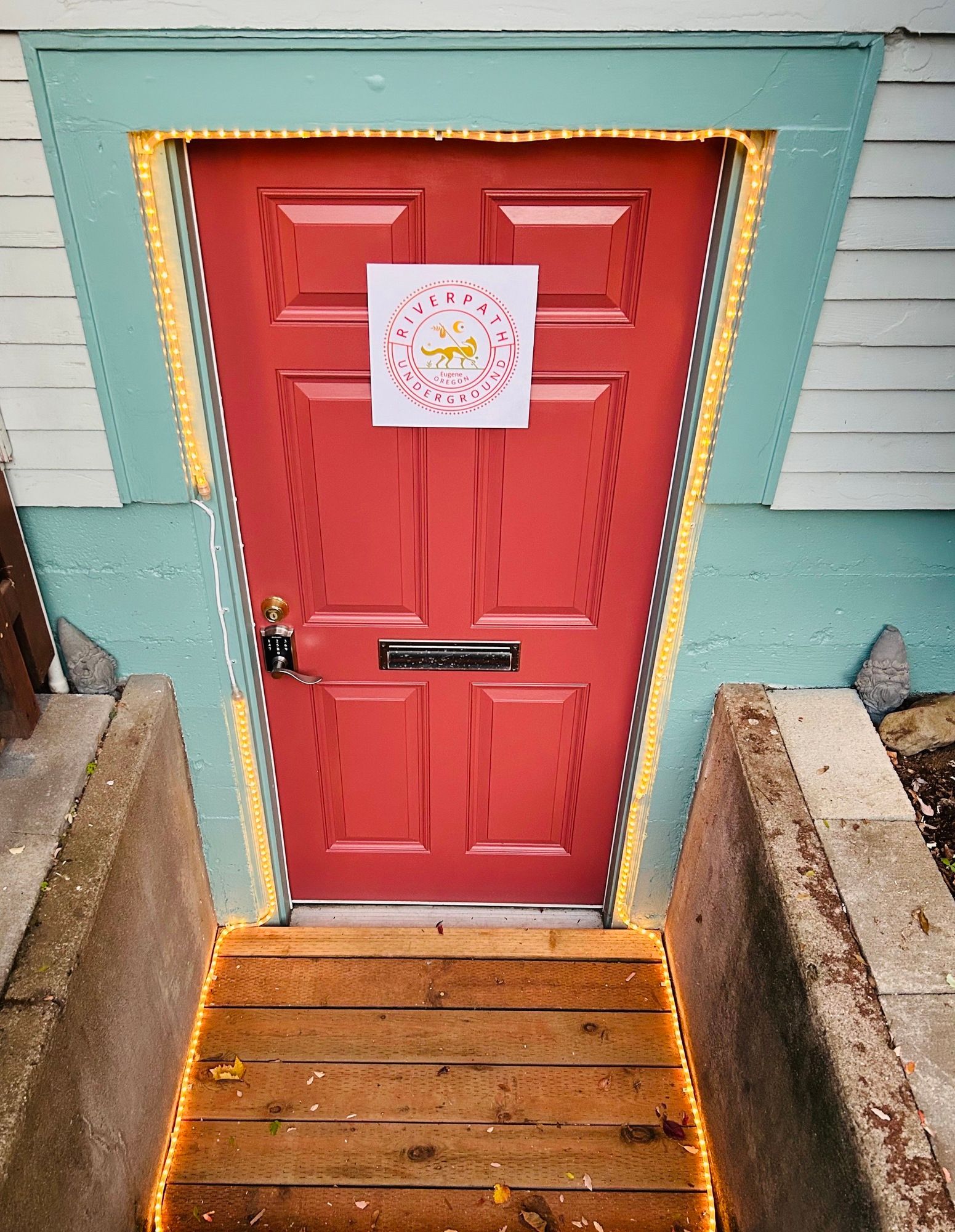 A red door with a sign on it that says happy birthday
