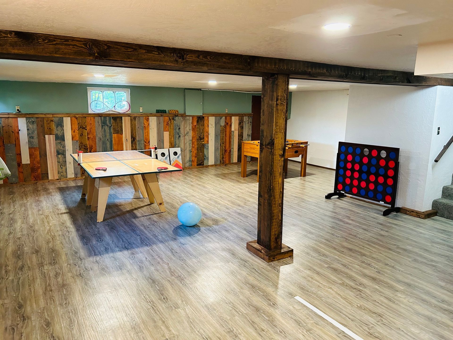 There is a ping pong table in the middle of the room.