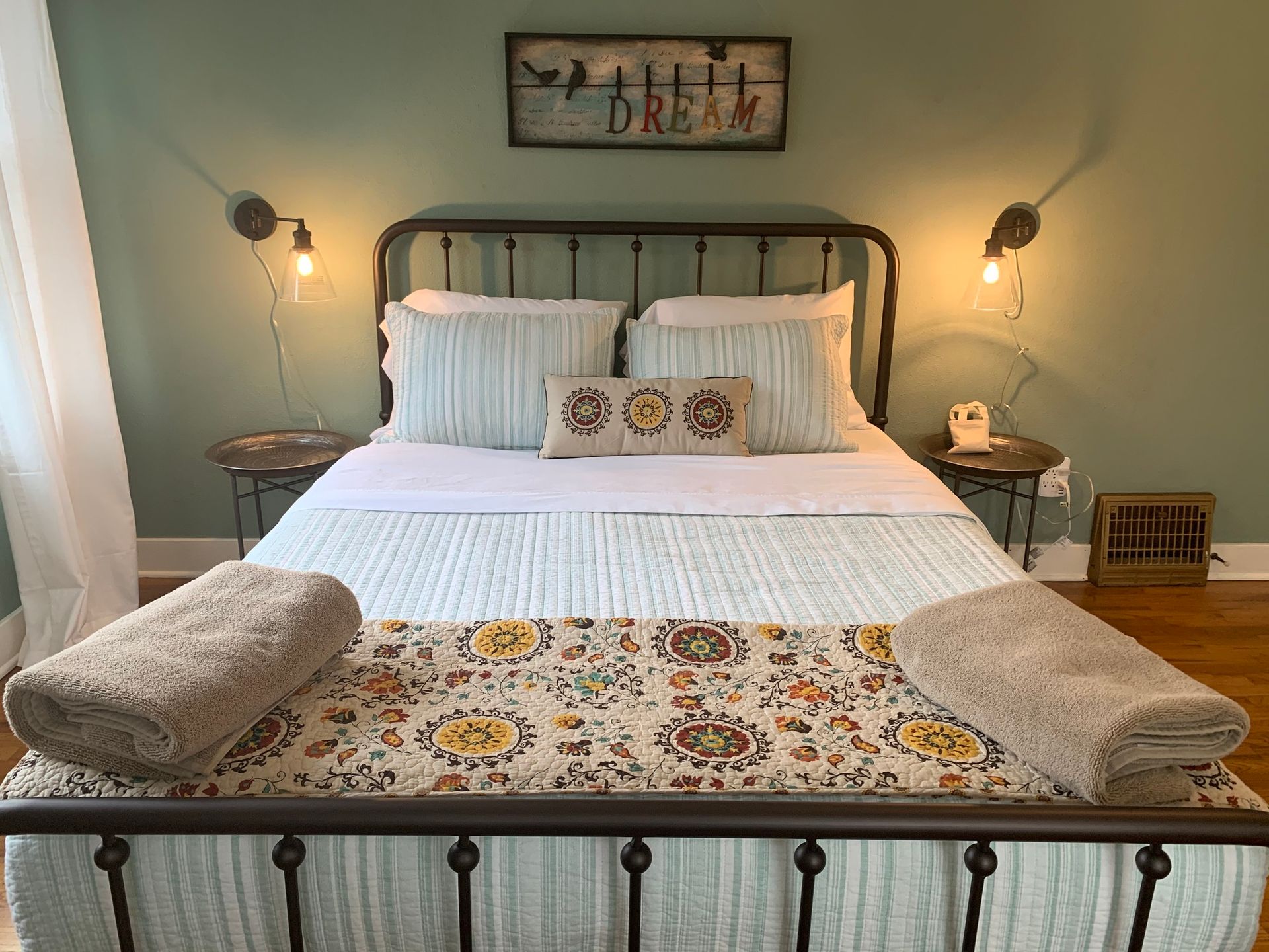 A bed with a sign above it that says `` all i dream ''