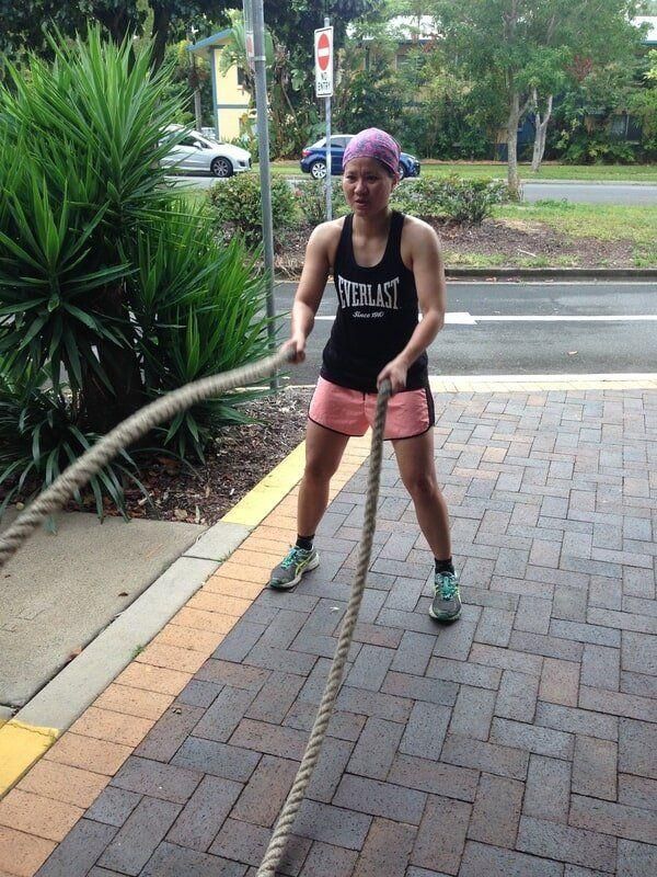 A Woman Wearing a Tank Top that Says Everlast Is Pulling a Rope — Maxenergy Fitness In Smithfield, QLD