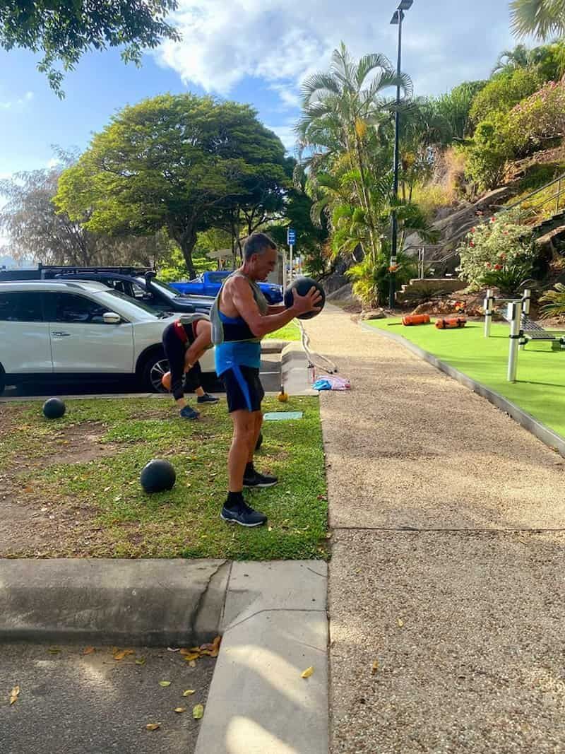 A Group Of People Are Doing Exercises In A Park — Maxenergy Fitness In Smithfield, QLD
