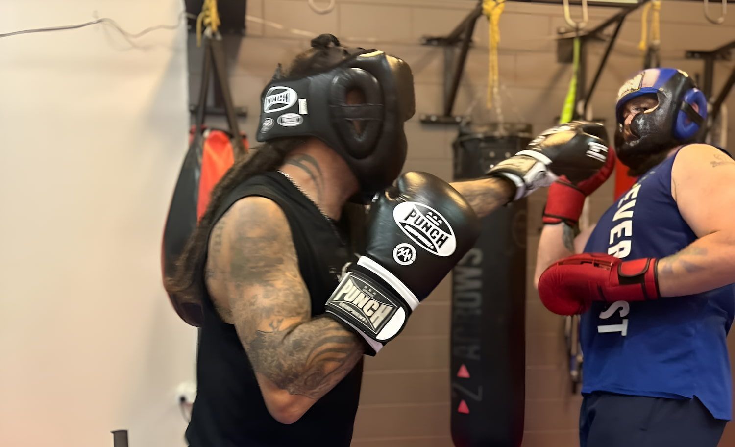 Two Men Are Boxing In A Gym And One Of Them Is Wearing A Shirt That Says Everlast — Maxenergy Fitness In Smithfield, QLD