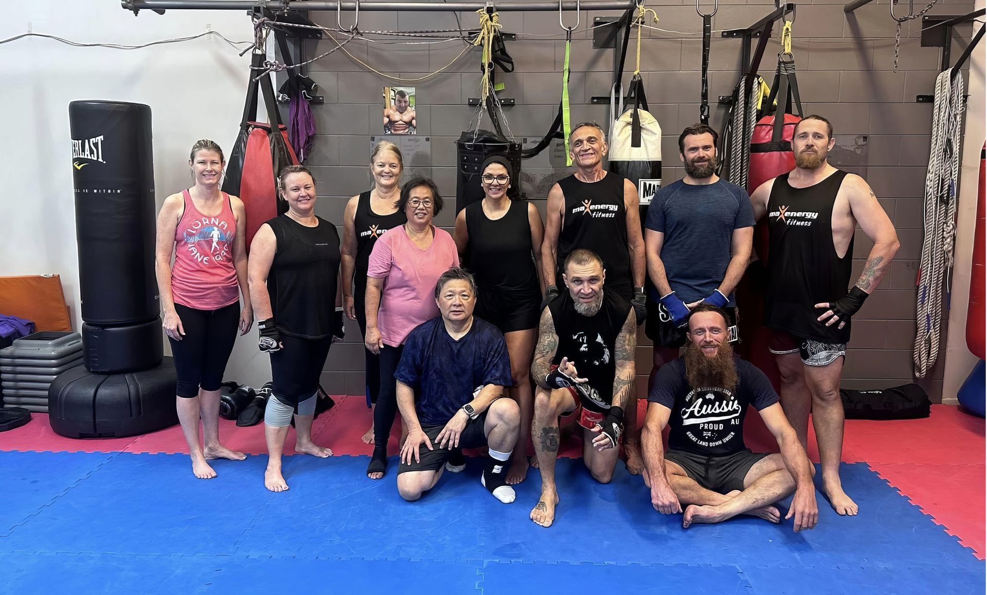 A Group of People Are Posing for A Picture in A Gym — Maxenergy Fitness In Smithfield, QLD