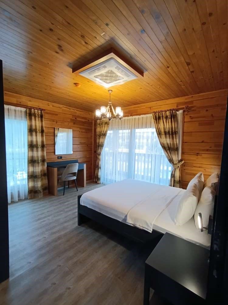 Our Wooden Suite room consists of 1 Living Room, 1 Bedroom, and 1 Children`s Room. The rooms are separated by a door.