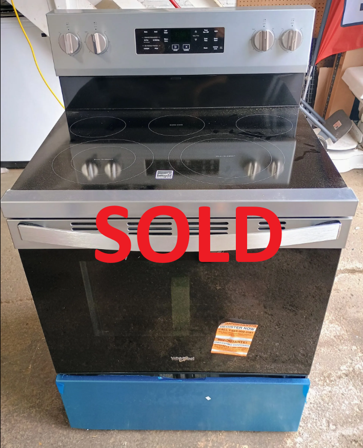 Silver and black electric range with a glass cooktop and oven.