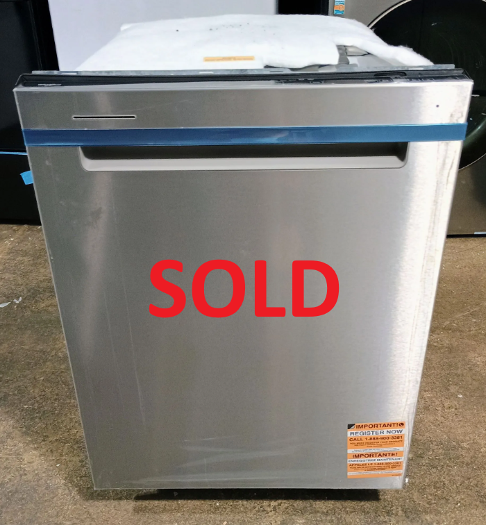 Stainless steel dishwasher with blue tape around the door, indoors.