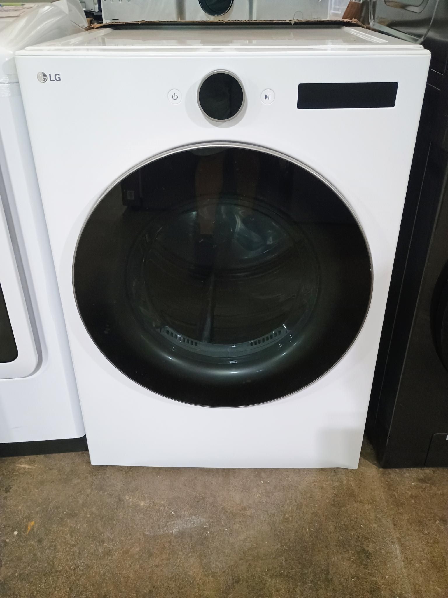 White LG dryer with black door and controls.