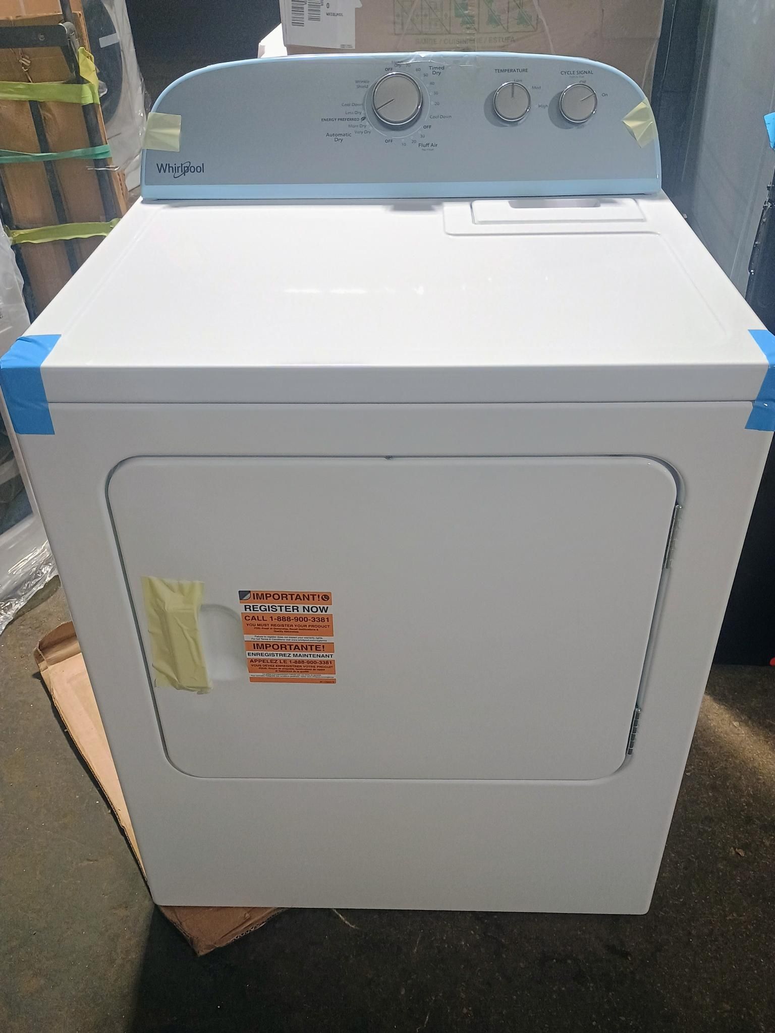 White electric dryer with light blue control panel.