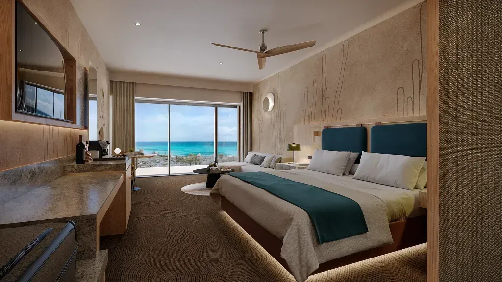 Hotel room with king bed, ocean view, modern decor, and large window.