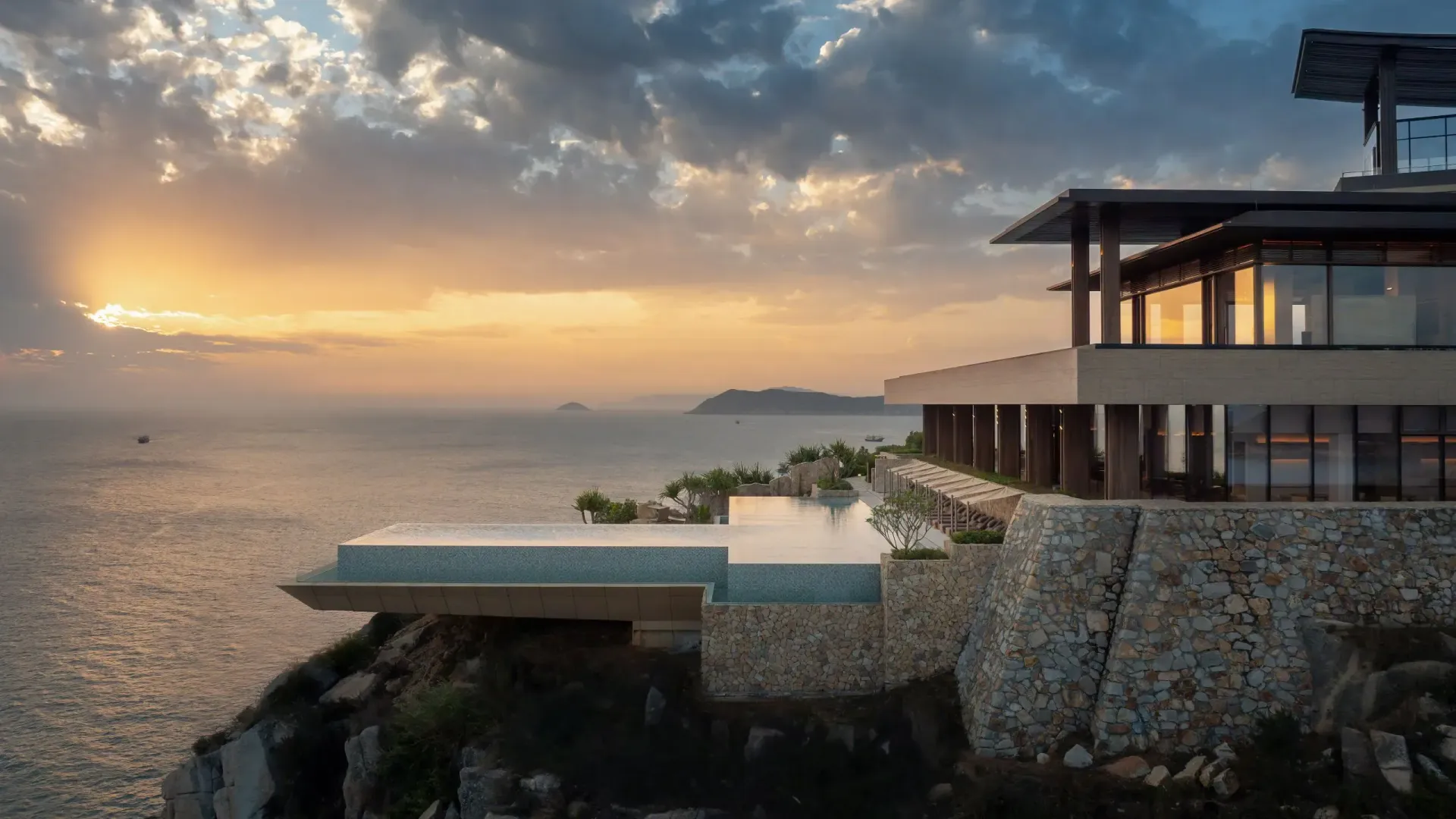 Woman preparing herbs in a mortar and pestle on a wooden table.