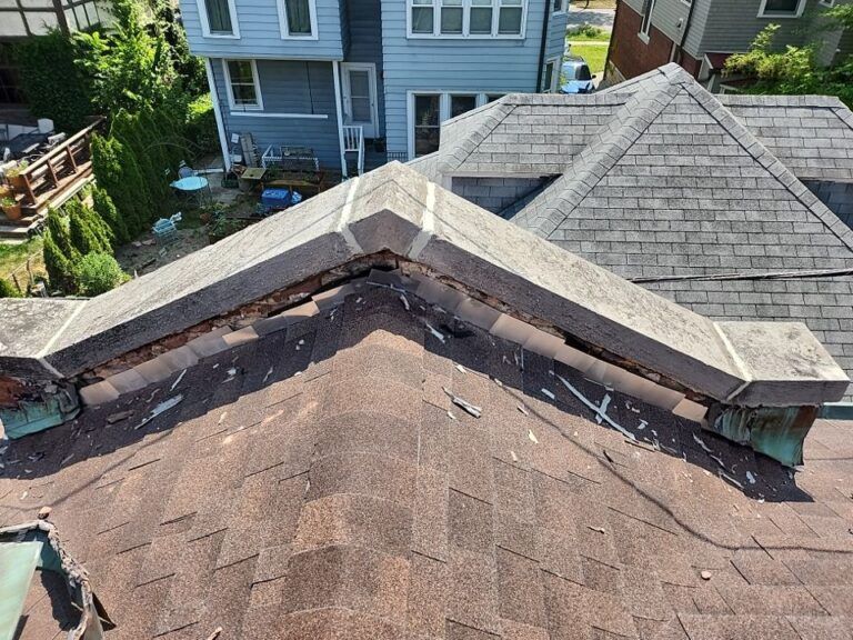 An aerial view of a roof with a chimney on it.