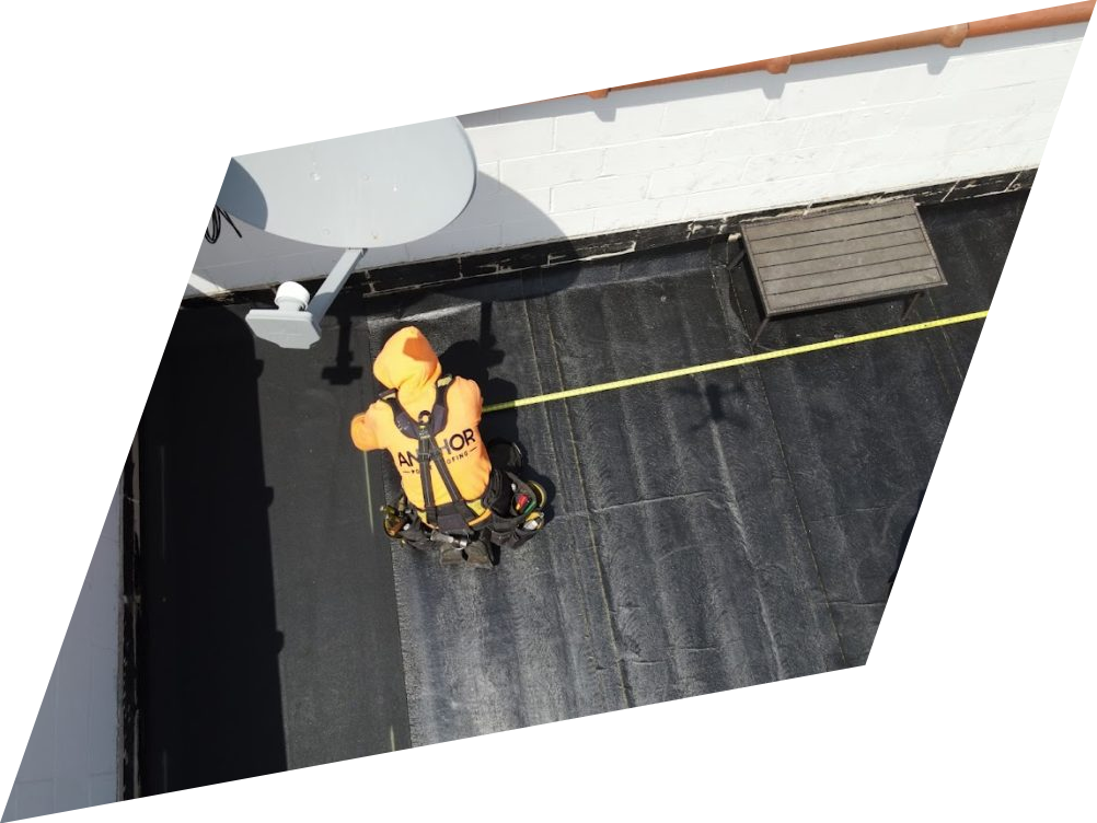 An aerial view of a person standing on a roof