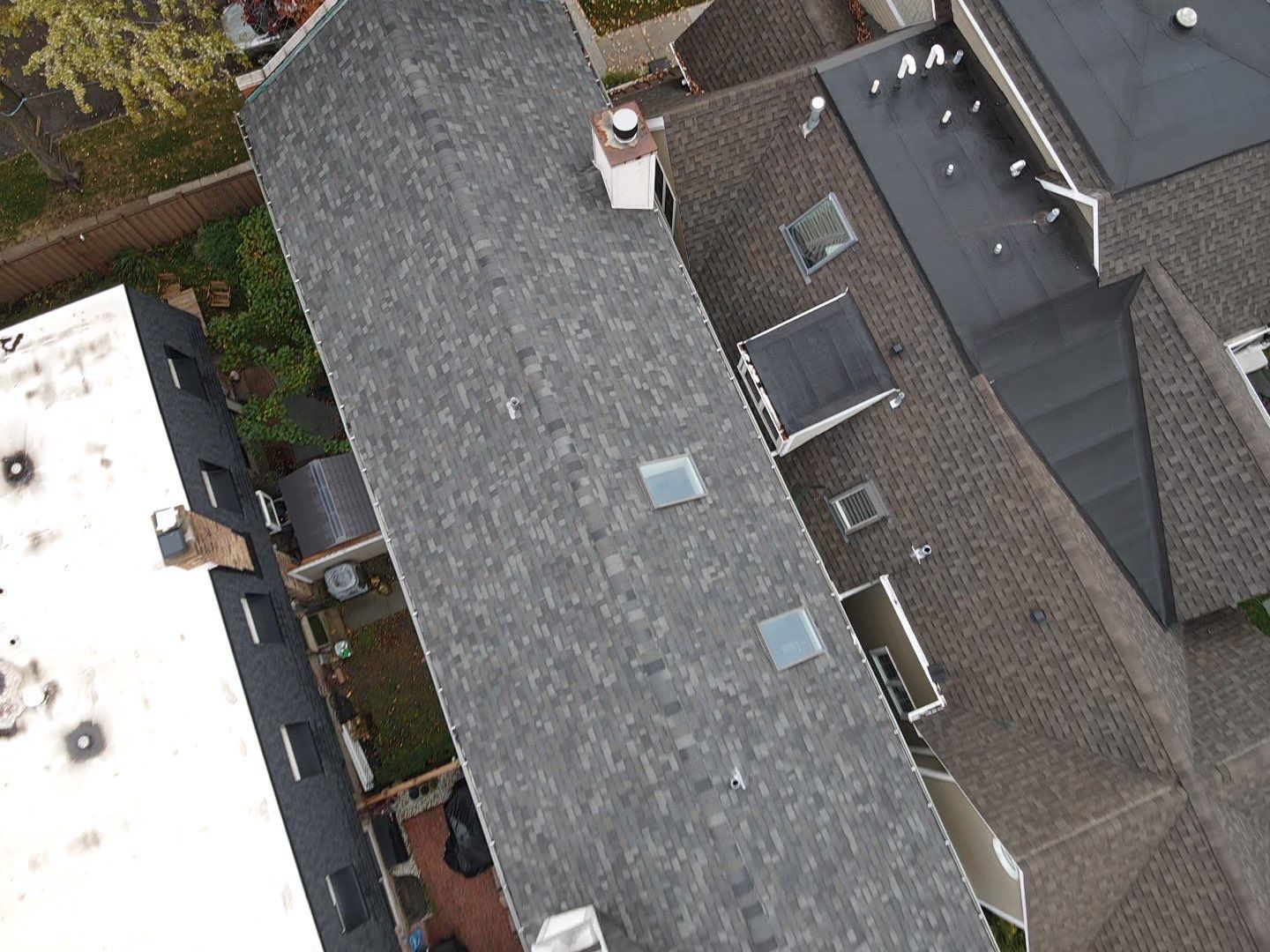 An aerial view of a roof with a chimney on top of it.