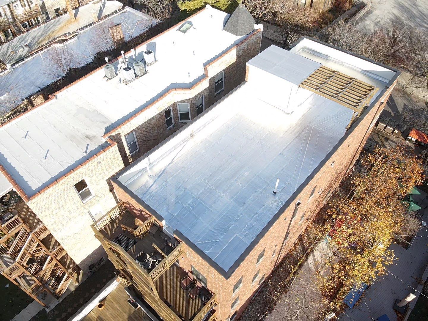 An aerial view of a building with a flat roof