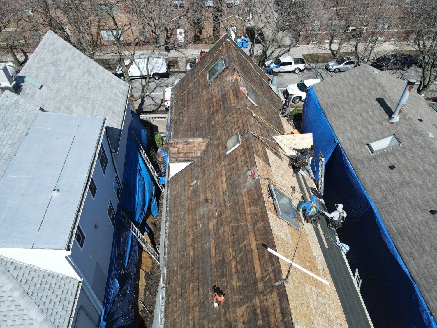 An aerial view of a roof that is being repaired