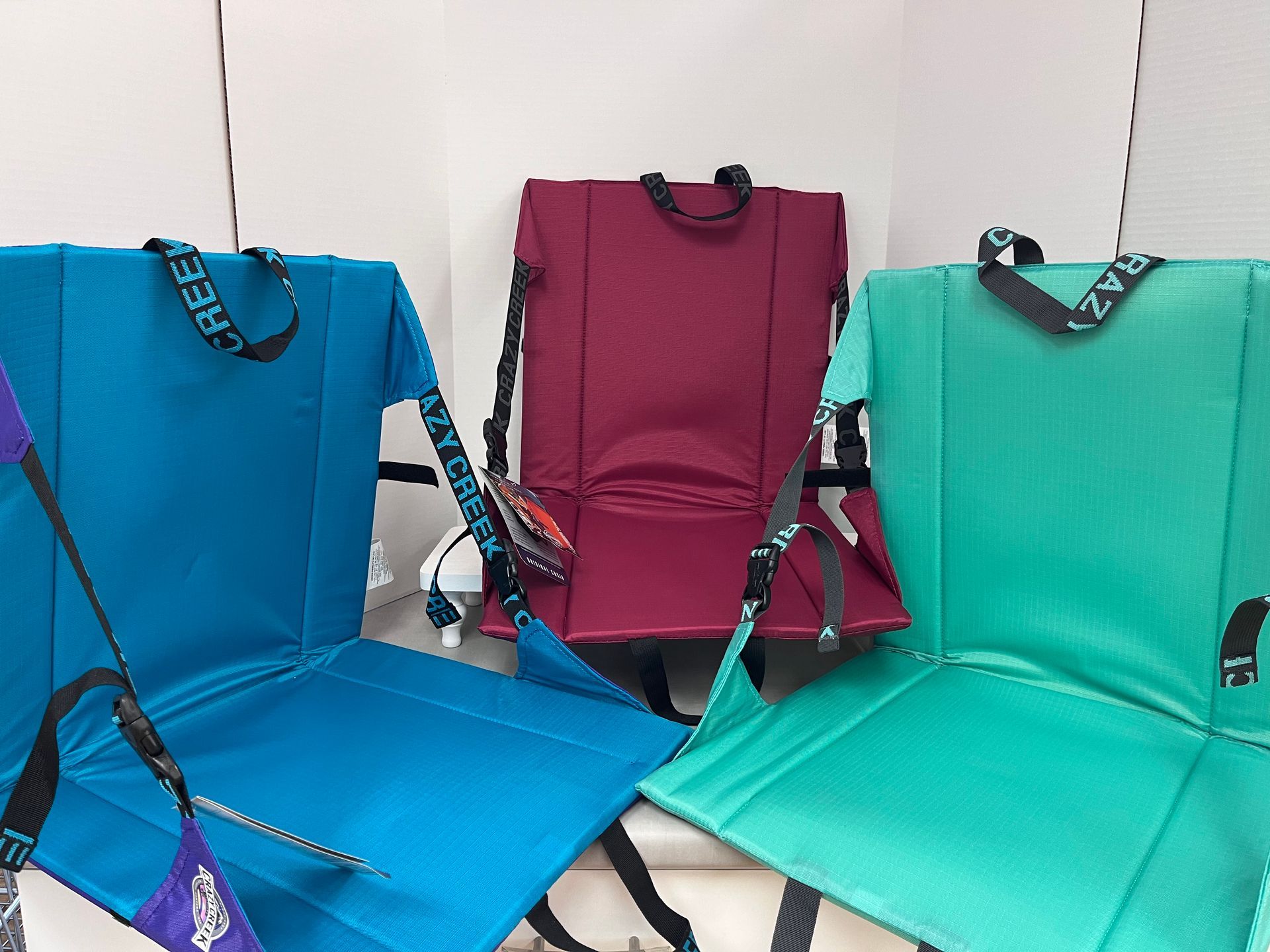 three chairs are sitting next to each other on a table .