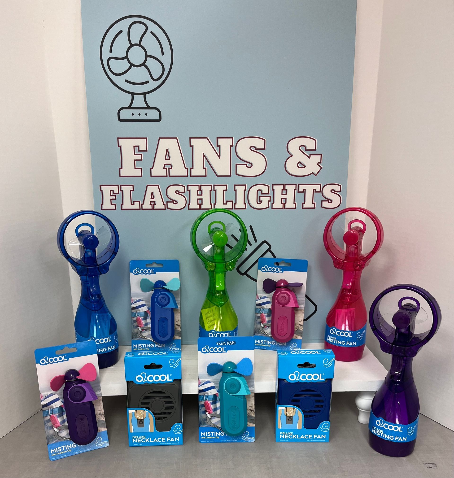 a variety of handheld fans and flashlights are on display
