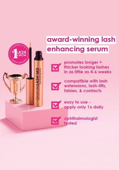 a bottle of award winning lash enhancing serum is sitting on top of a pink box .