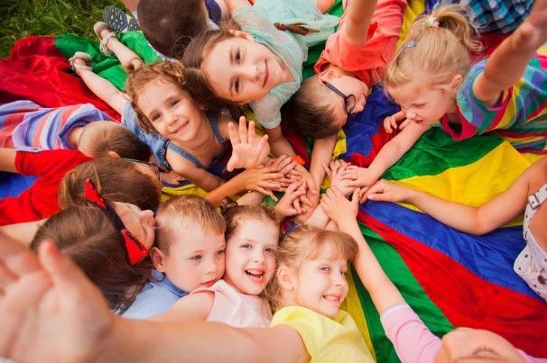 a group of children are posing for a picture together .
