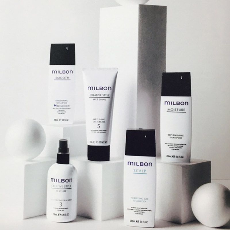 several bottles of milbon hair products are on display
