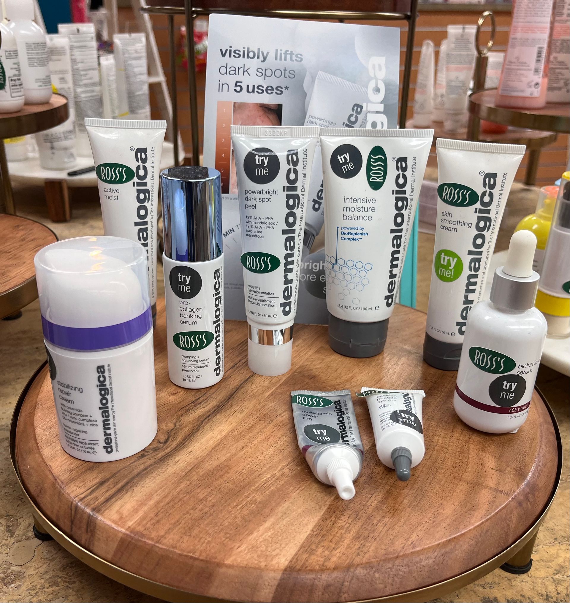 a display of dermalogica products on a wooden tray .