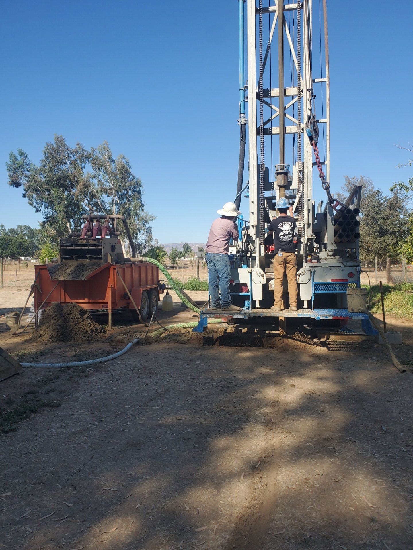 A group of men are working on a large machine