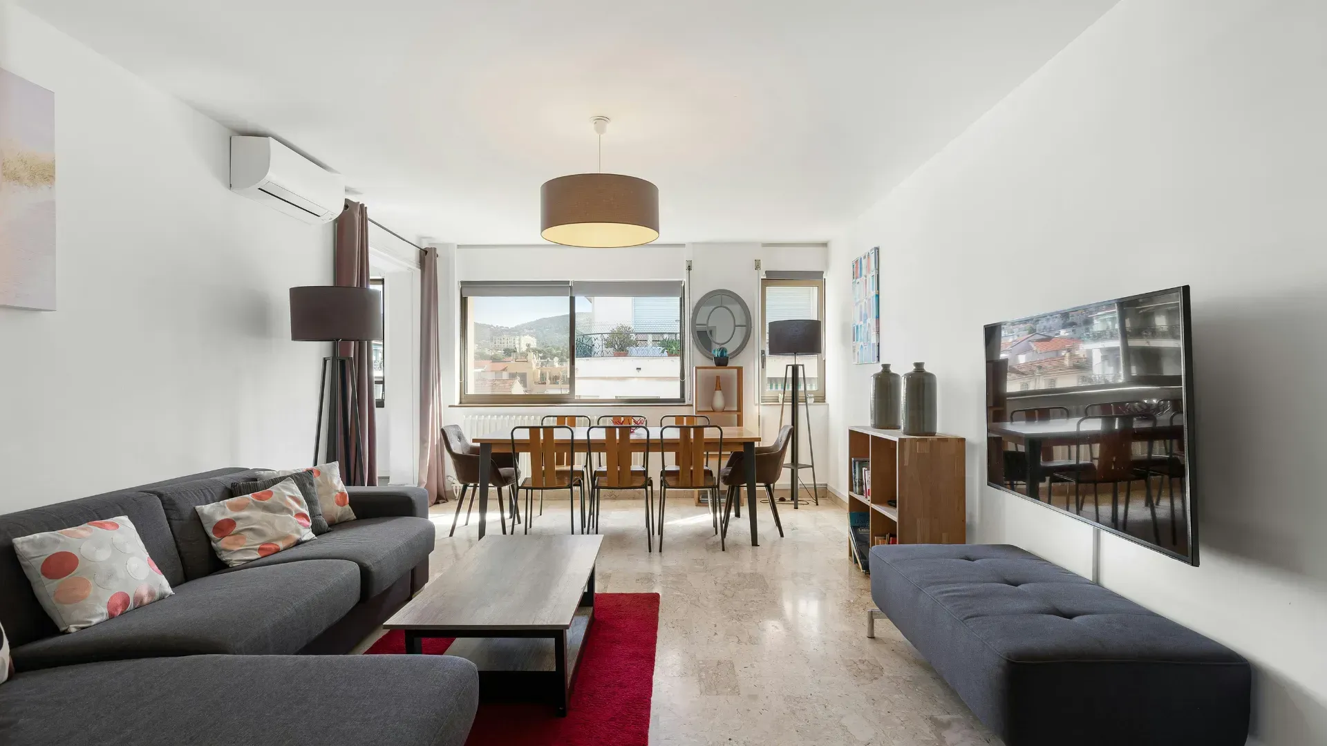 A living room with a couch , table and television.