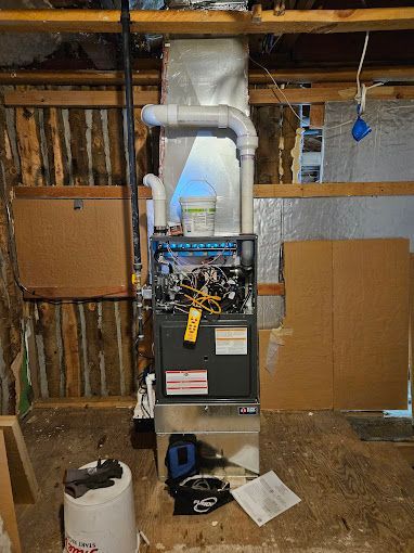 A heating system is being installed in a basement.