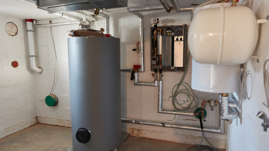 There is a water heater in the middle of the room.