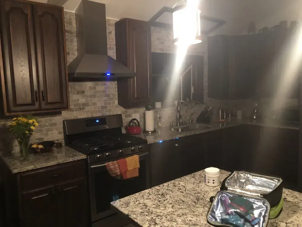 A kitchen with stainless steel appliances and granite counter tops