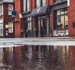 Flood water on the street of a store front