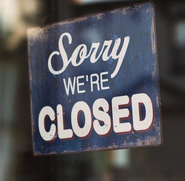 Closed business sign on the front of a business