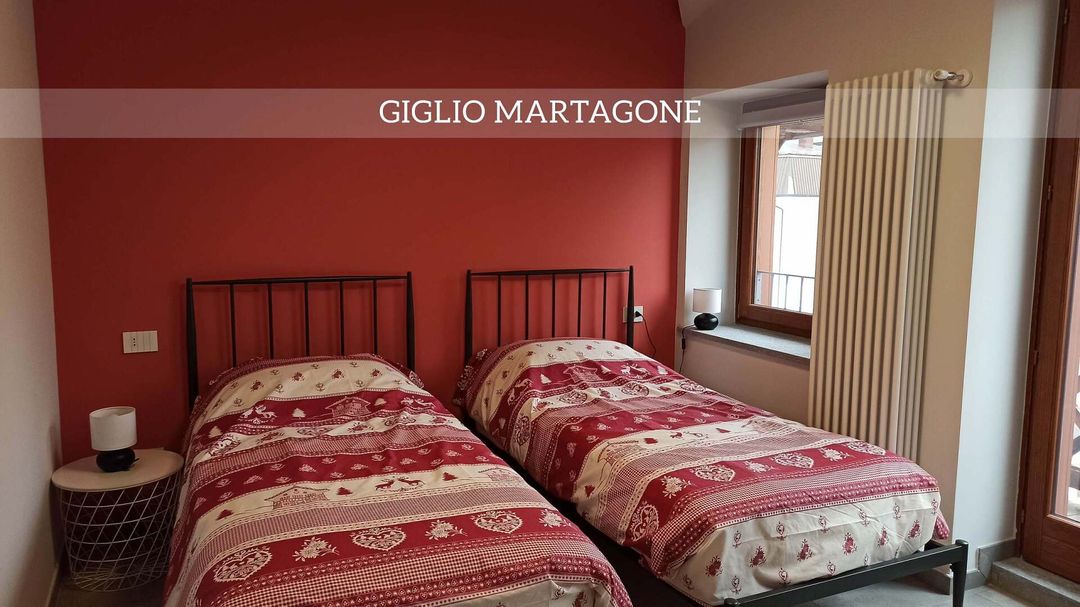 coppia di letti dentro l'appartamento Giglio Martagone
