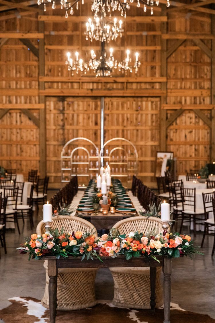 Wedding Reception in a with a Long Table and Chairs by Wedding Planner Nashville