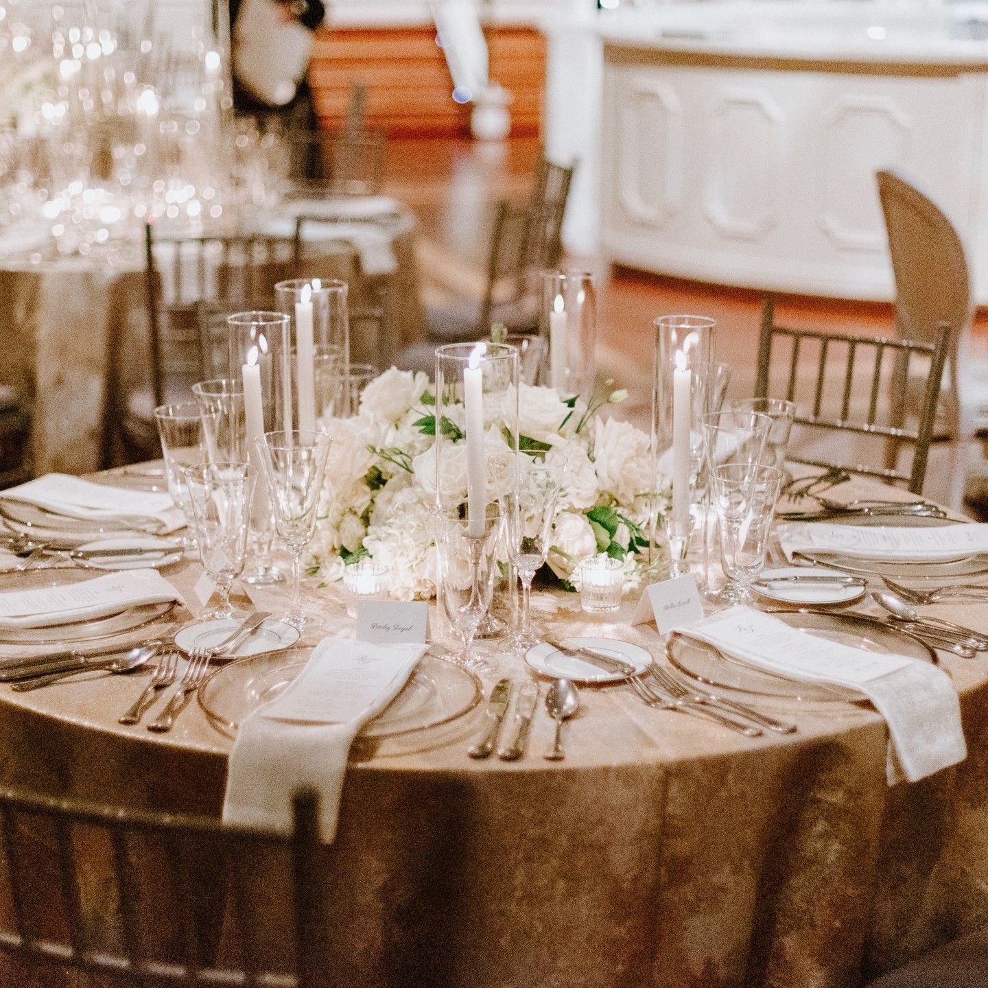 Wedding Reception room with tables and chairs decorated with candles and lanterns by Wedding Planner Nashville.