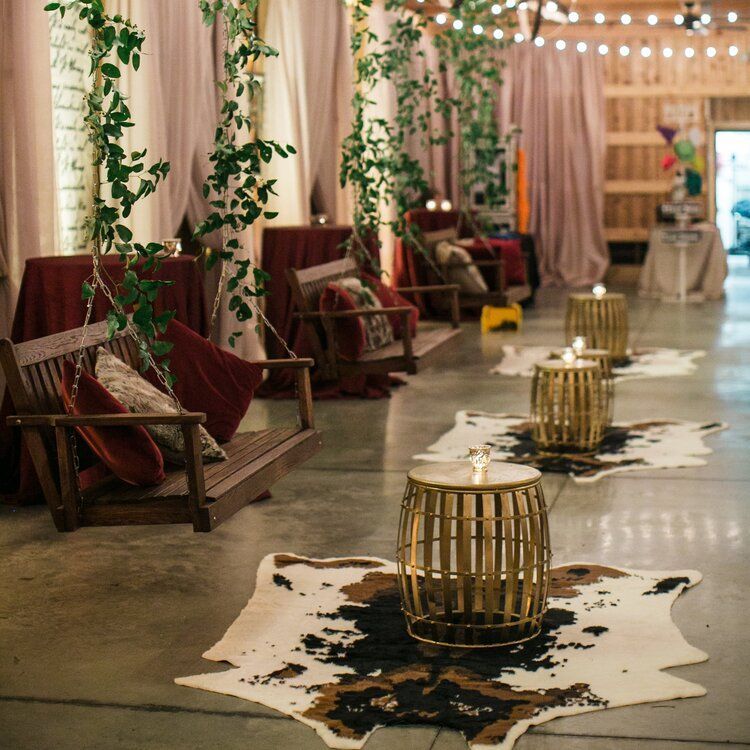 A Wedding Reception in a with a Long Table and Chairs by Wedding Planner Nashville