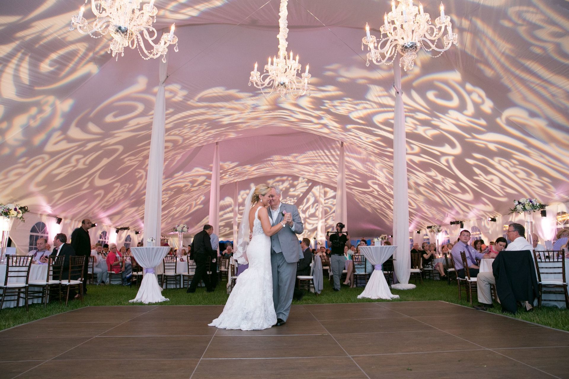 Martha and Dustin dancing under a tent at their wedding reception by Wedding Planner Nashville