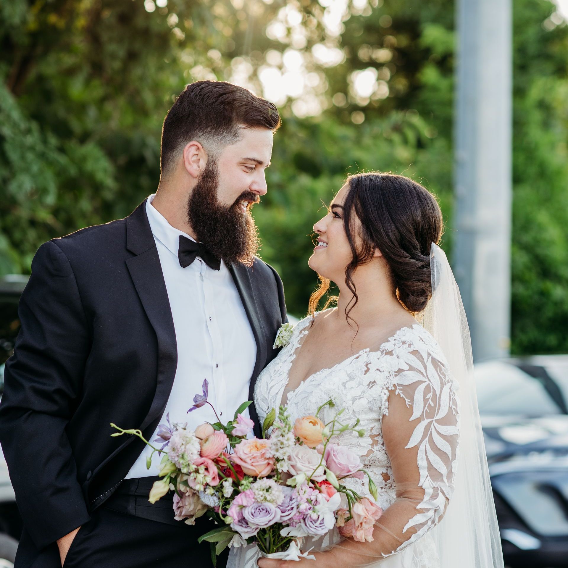 A Bride in a Wedding Dress Is Walking Down the Aisle with Her Groom by Wedding Planner Nashville