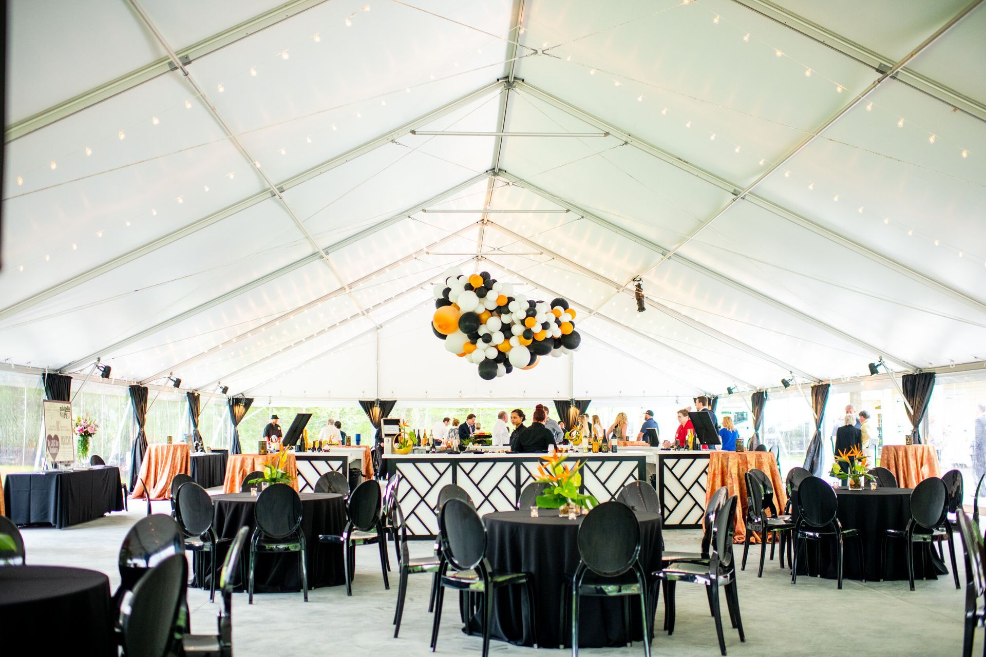 Tri-Chamber Meeting, large tent filled with tables and chairs and balloons hanging from the ceiling by Event Planner Nashville