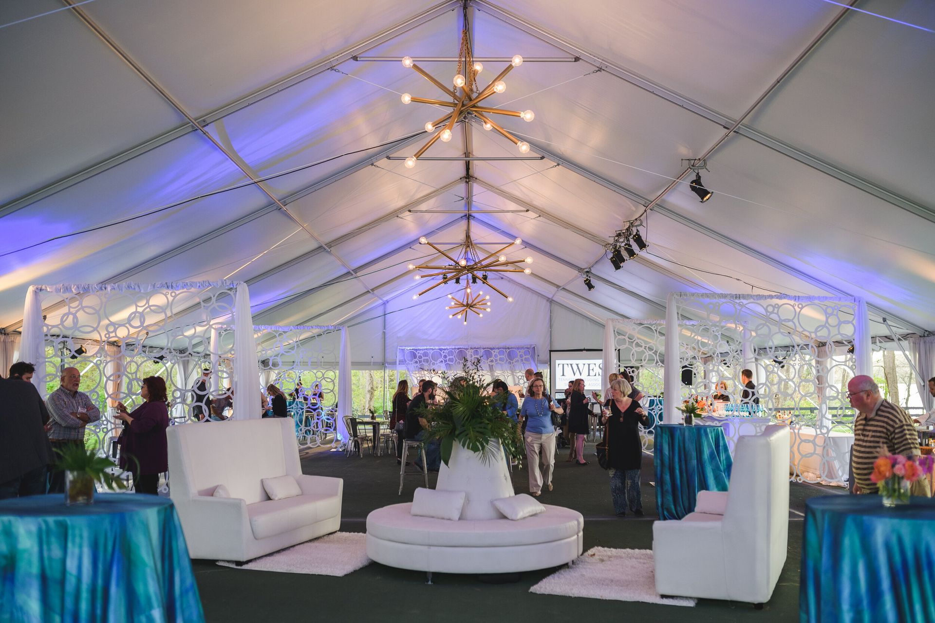 Wedding Market News, large tent with tables and chairs inside of it by Event Planner Nashville