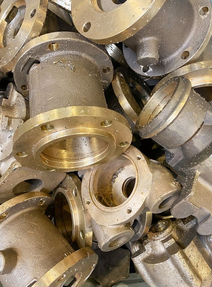 A Pile of Brass Parts Sitting on Top of Each Other — Beehive Property Maintenance in Emerald, QLD