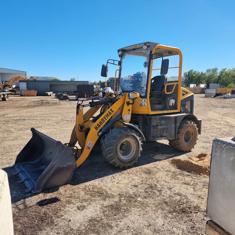 A Broom is Being Used to Clean a Brick Walkway — Beehive Property Maintenance in Clermont, QLD